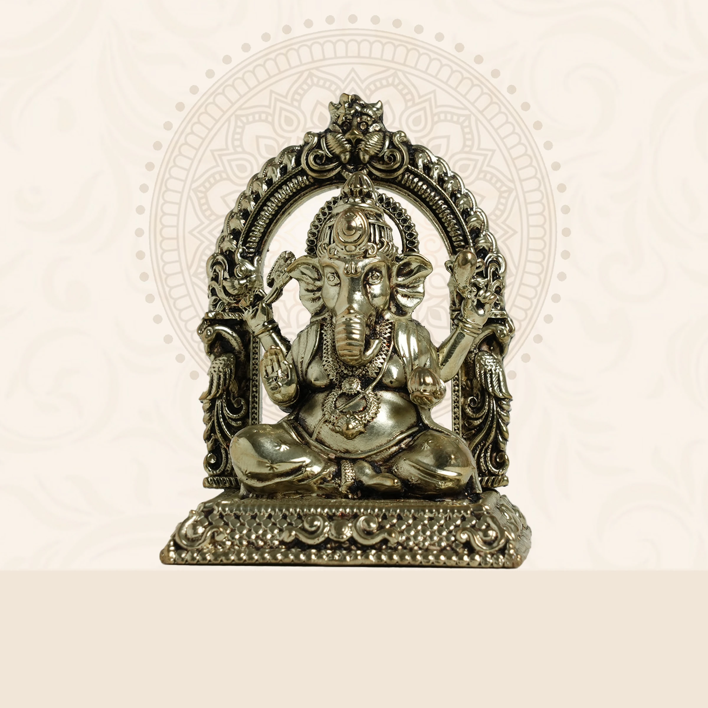 Lord Ganesha Brass Idol under an elegant ornamental arch